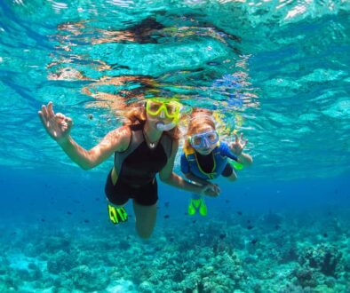 snorkeling mother and child