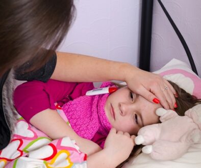 Mother taking care about sick sleeping daughter